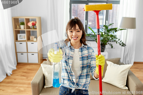 Image of asian woman with window cleaner and sponge mop