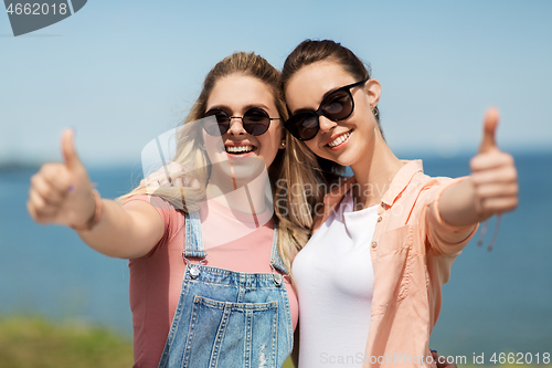 Image of teenage girls or best friends at seaside in summer