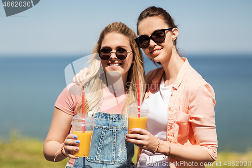 Image of teenage girls or friends with drinks in summer