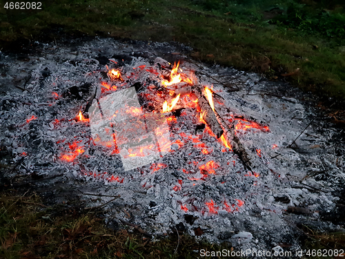 Image of Glowing embers of burning wood log fire
