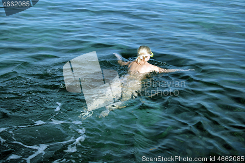 Image of Naked woman on the nudist beach