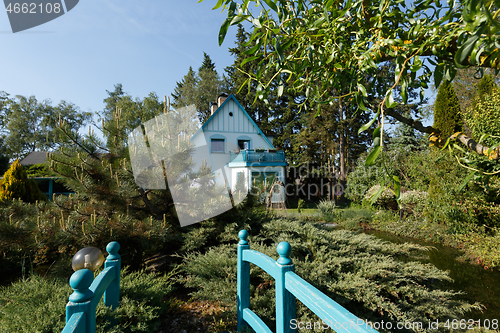 Image of Beautiful rural house in spring garden