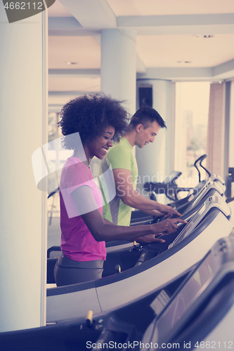 Image of people exercisinng a cardio on treadmill in gym