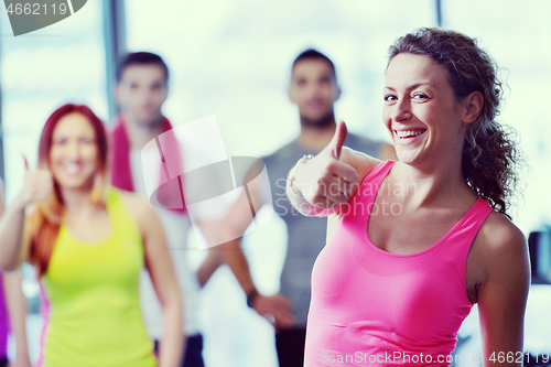 Image of Group of people exercising at the gym