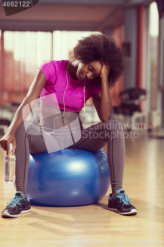 Image of woman  relaxing after pilates workout