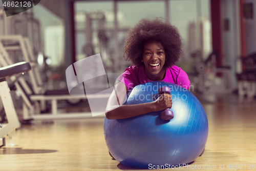 Image of woman  relaxing after pilates workout