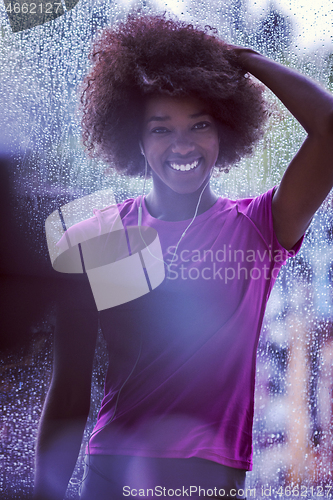 Image of portrait of young afro american woman in gym