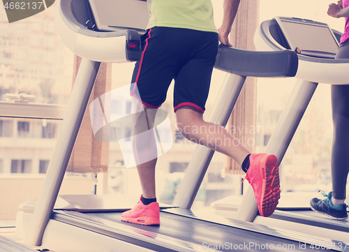 Image of people exercisinng a cardio on treadmill in gym