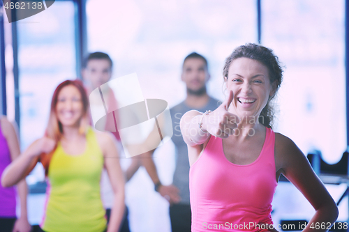 Image of Group of people exercising at the gym