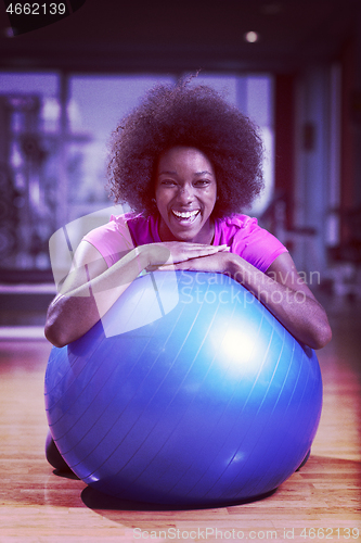 Image of woman  relaxing after pilates workout