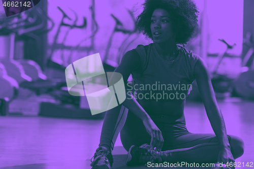 Image of african american woman exercise yoga in gym