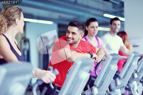 Image of Group of people running on treadmills