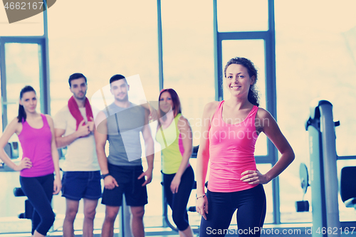 Image of Group of people exercising at the gym