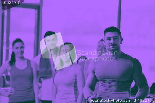 Image of Group of people exercising at the gym