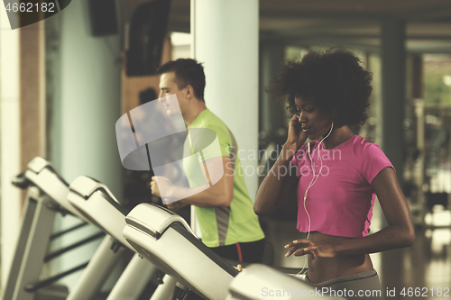 Image of people exercisinng a cardio on treadmill