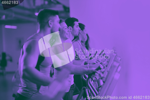 Image of Group of people running on treadmills