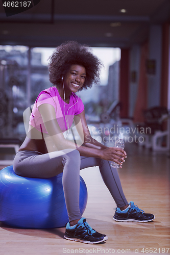 Image of woman  relaxing after pilates workout