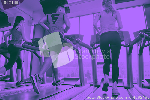 Image of woman exercising on treadmill in gym