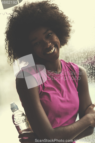 Image of portrait of young afro american woman in gym