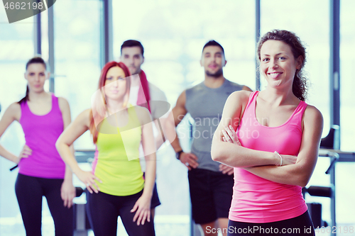 Image of Group of people exercising at the gym