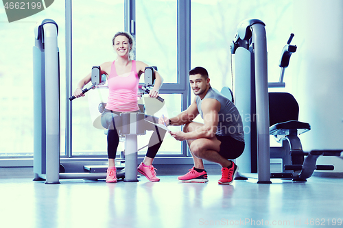 Image of woman exercising with her personal trainer