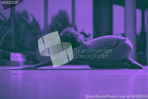 Image of african american woman exercise yoga in gym