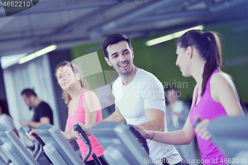 Image of Group of people running on treadmills