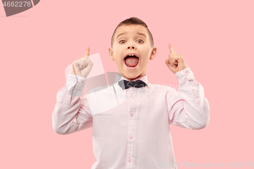 Image of Isolated on pink young casual boy shouting at studio