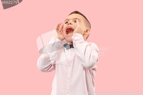 Image of Isolated on pink young casual boy shouting at studio