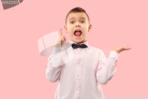 Image of Isolated on pink young casual boy shouting at studio