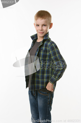 Image of Portrait of a ten year old boy sticking his chest forward