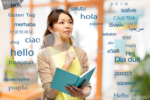 Image of asian student woman with diary and pencil