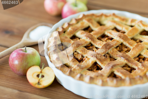 Image of close up of apple pie on wooden table