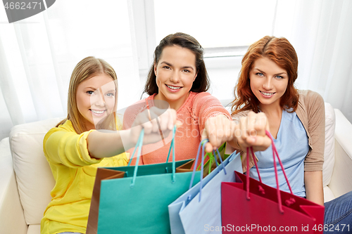 Image of teenage girls with shopping bags at home