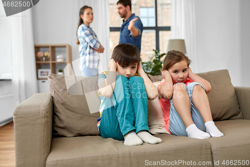 Image of sad children and parents quarreling at home