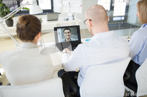 Image of business team having video conference at office