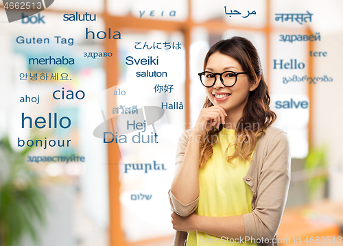 Image of happy asian woman in glasses or student