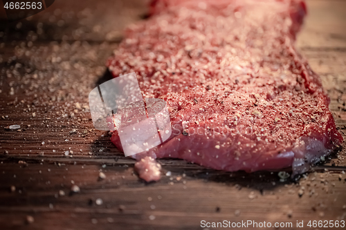 Image of Mixed pepper and spices on the raw meat steak