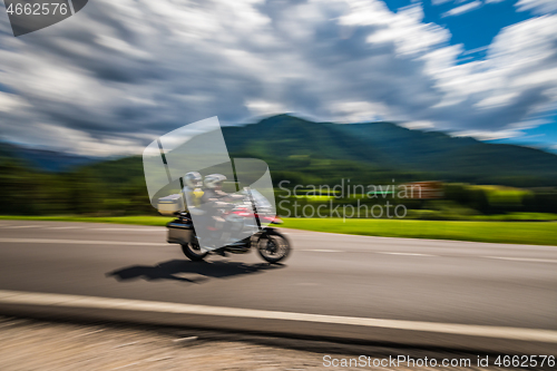 Image of Tricycle Blurred motion Bikers on the road