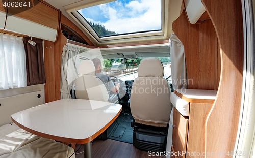 Image of Man driving on a road in the Camper Van RV