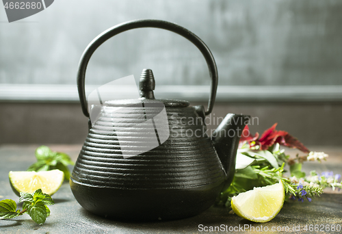 Image of teapot and herb