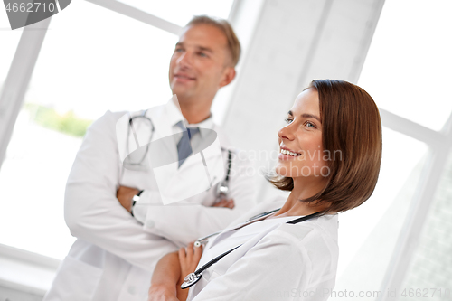 Image of smiling doctors in white coats at hospital