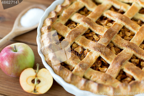 Image of close up of apple pie on wooden table