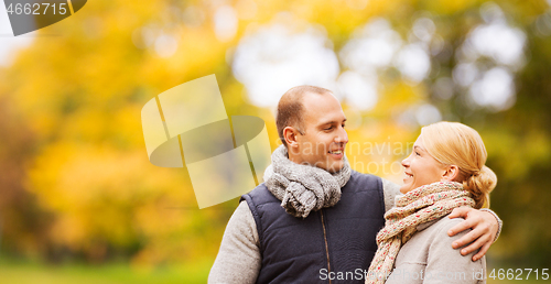 Image of smiling couple in autumn park