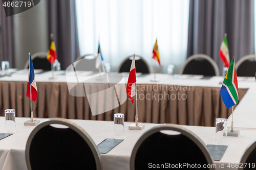 Image of table in boardroom at international conference