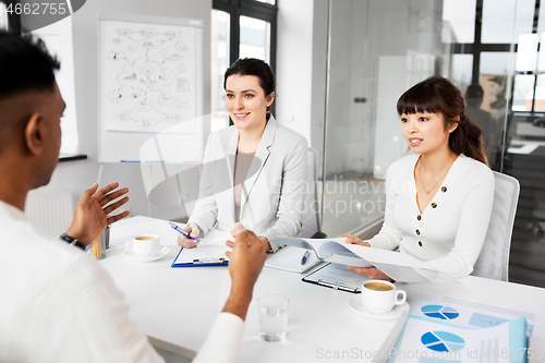 Image of recruiters having job interview with employee