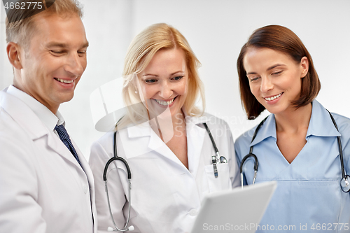 Image of group of doctors with tablet computer at hospital