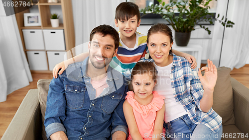 Image of portrait of happy family at home