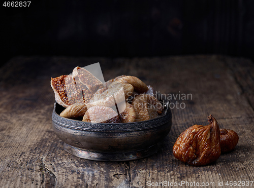 Image of dried figs on rustic wooden table