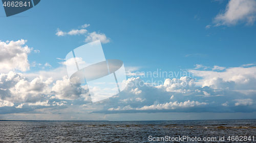 Image of seascape with beautiful white clouds